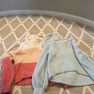 Two SO sweatshirts one is multi color and one is blue